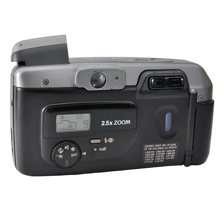 Rear view of Canon Z70W LCD screen displaying battery level and mode dial with AUTO SPOT settings