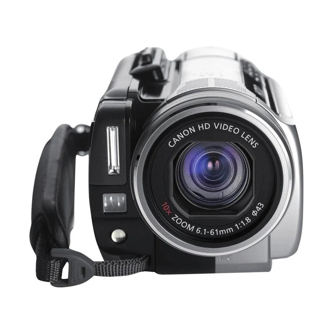 Front view of black Canon VIXIA HG10 HD camcorder with silver accents and built-in flash at ClubCamera.com