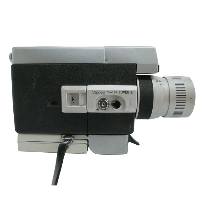 Rear view of Canon Zoom 518 Super 8 camera highlighting silver control panel and distance markings at ClubCamera.com
