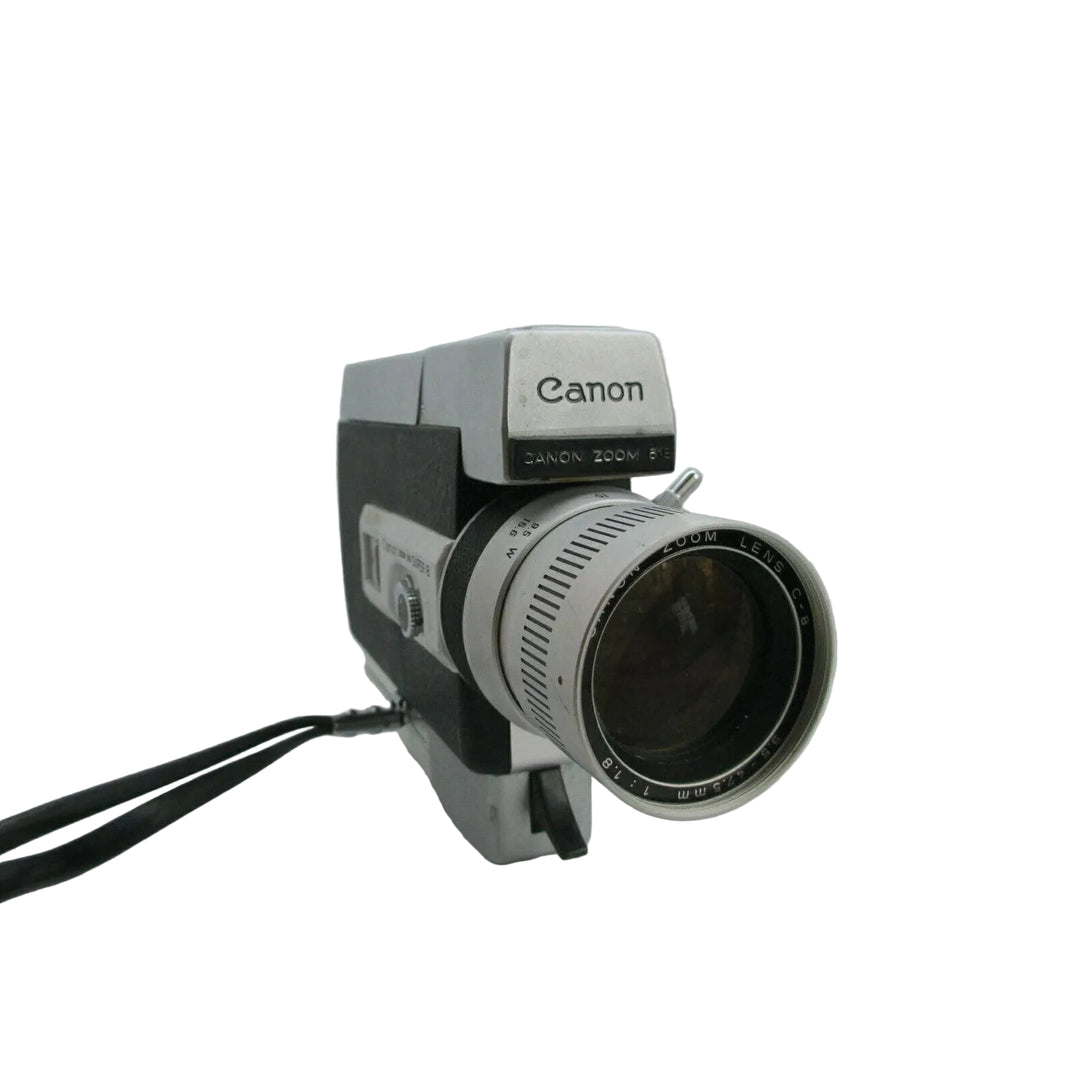 Close-up of Canon Zoom 318 Super 8 lens showing ZOOM LENS 1:1.8 engraved text on silver barrel at ClubCamera.com