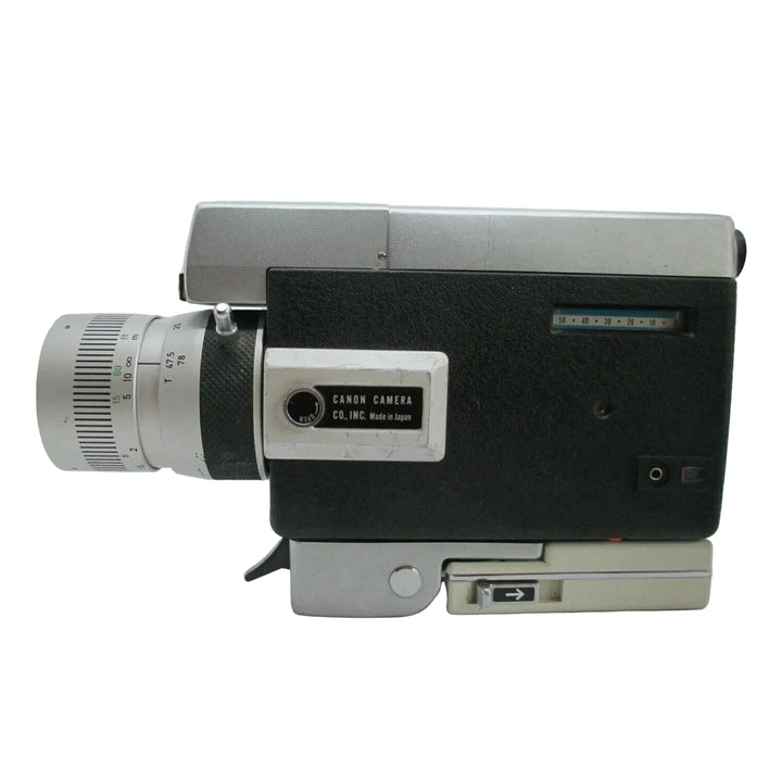 Top-rear angle of Canon Zoom 318 Super 8 displaying Made in Japan plate and exposure scale window at ClubCamera.com