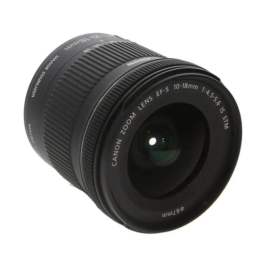 ClubCamera Canon EF-S 10-18mm f/4.5-5.6 IS STM lens three-quarter view with textured focus ring and green glass reflection