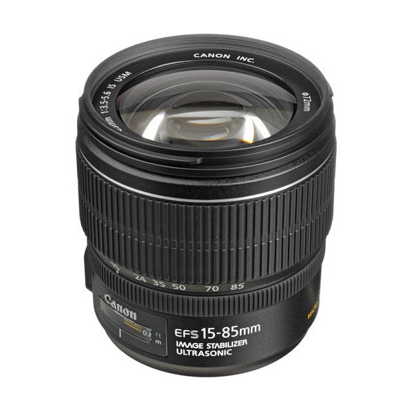 ClubCamera top-down shot of Canon EF-S 15-85mm f/3.5-5.6 IS USM lens revealing convex glass element and ø77mm rim text