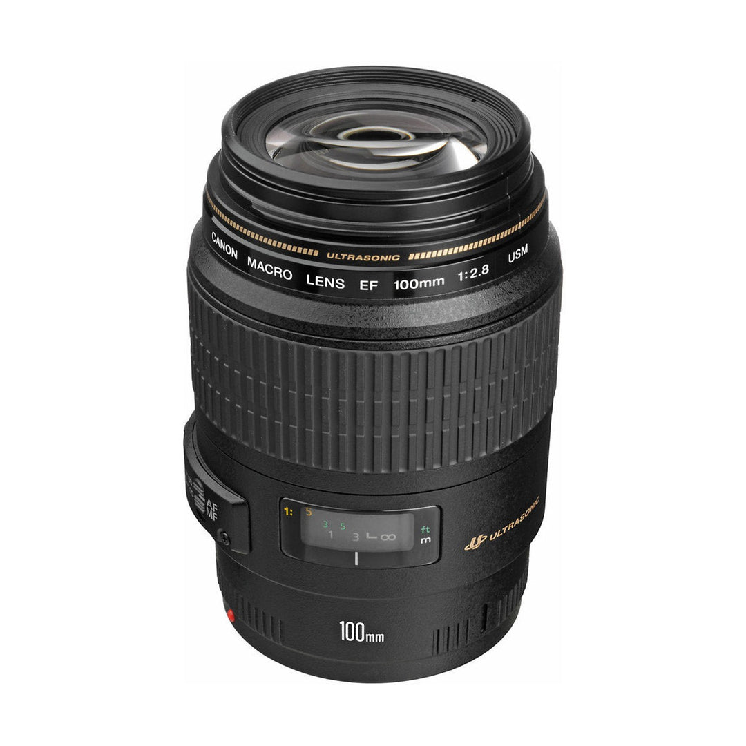 Canon EF 100mm f/2.8 Macro USM lens front view with gold focus scale and Ultrasonic motor logo at ClubCamera.com