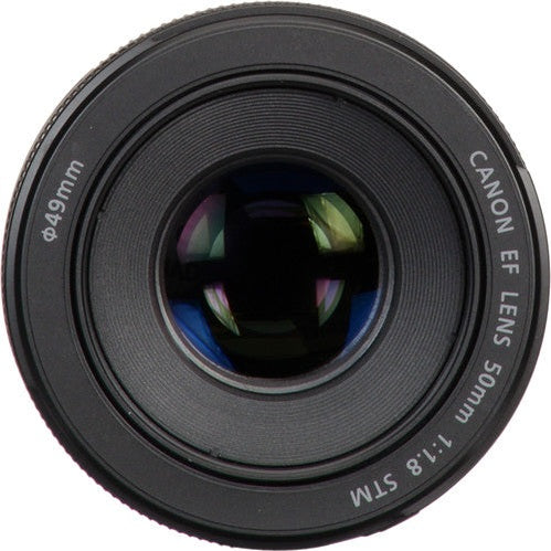 Close-up of Canon EF 50mm f/1.8 STM multi-coated glass front element with purple reflections