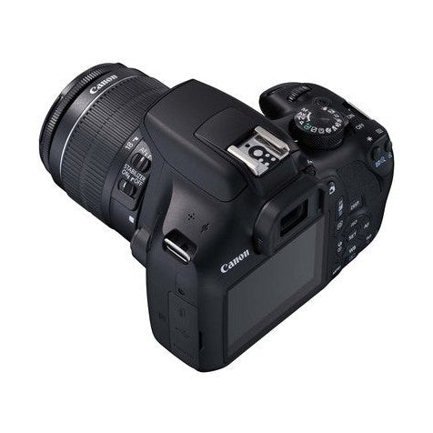 Rear angle of black Canon EOS 1300D DSLR displaying LCD screen, ports, and control dial with attached lens at ClubCamera.com