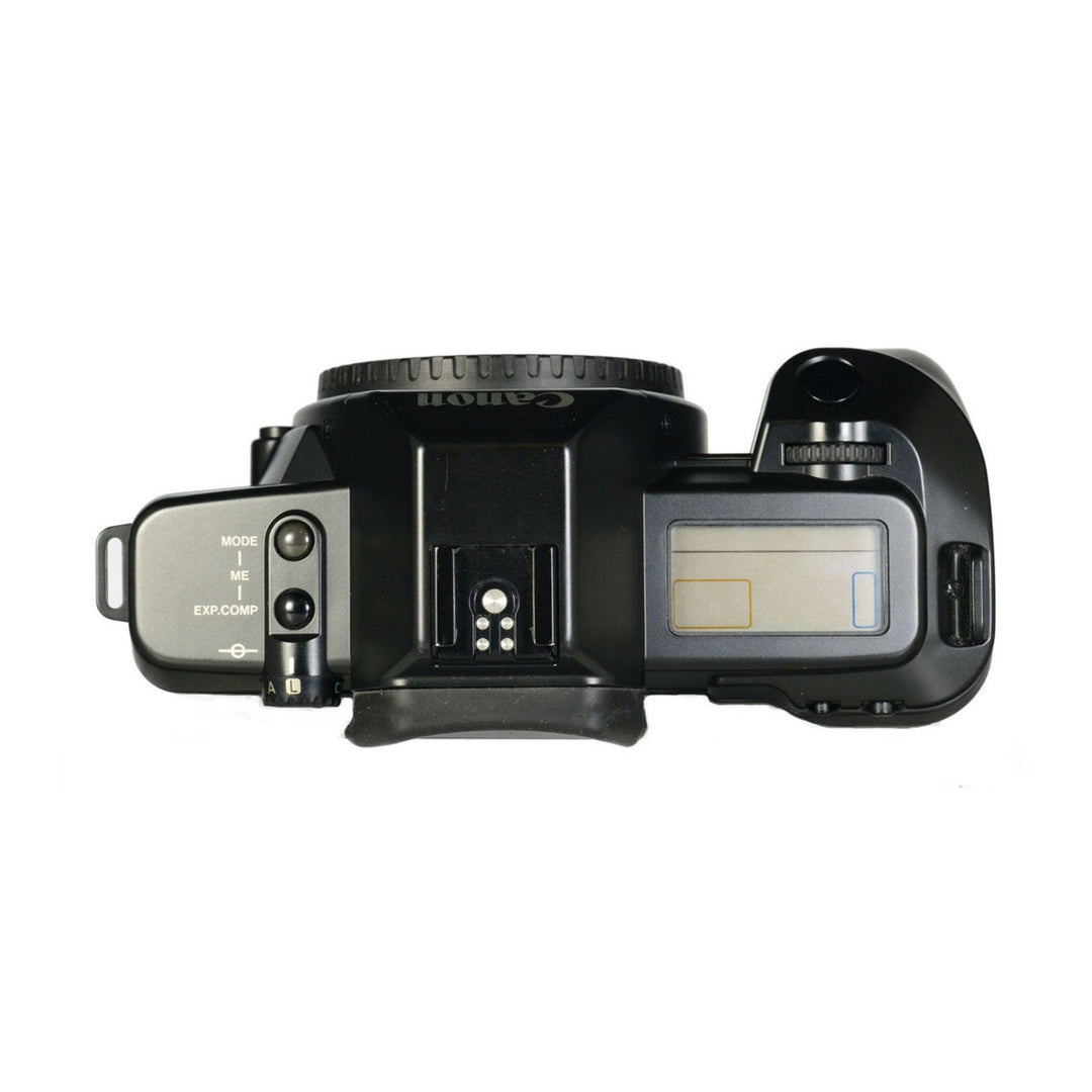Top control layout of black Canon EOS 620 film camera with mode dial and LCD screen sold by ClubCamera.com