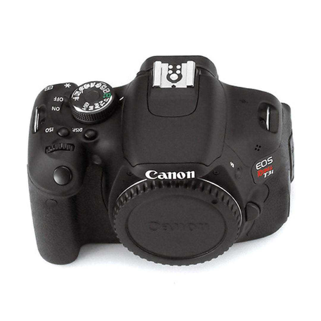 Top view of black Canon EOS Rebel T3i DSLR mode dial set to P at ClubCamera.com with visible ISO button and flash housing