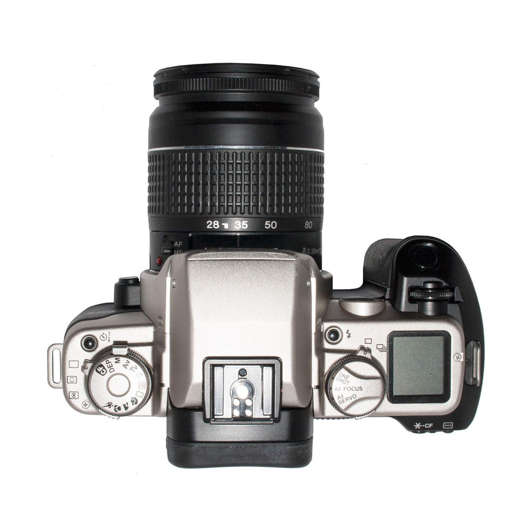 Top-down view of Canon Elan II SLR with PASM mode dial and hot shoe flash mount at ClubCamera.com