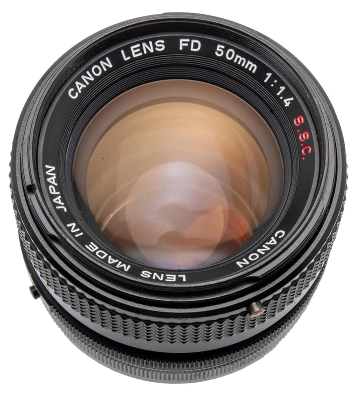 Canon FD 50mm f/1.4 lens with engraved S.S.C. text and red markings sold by ClubCamera.com