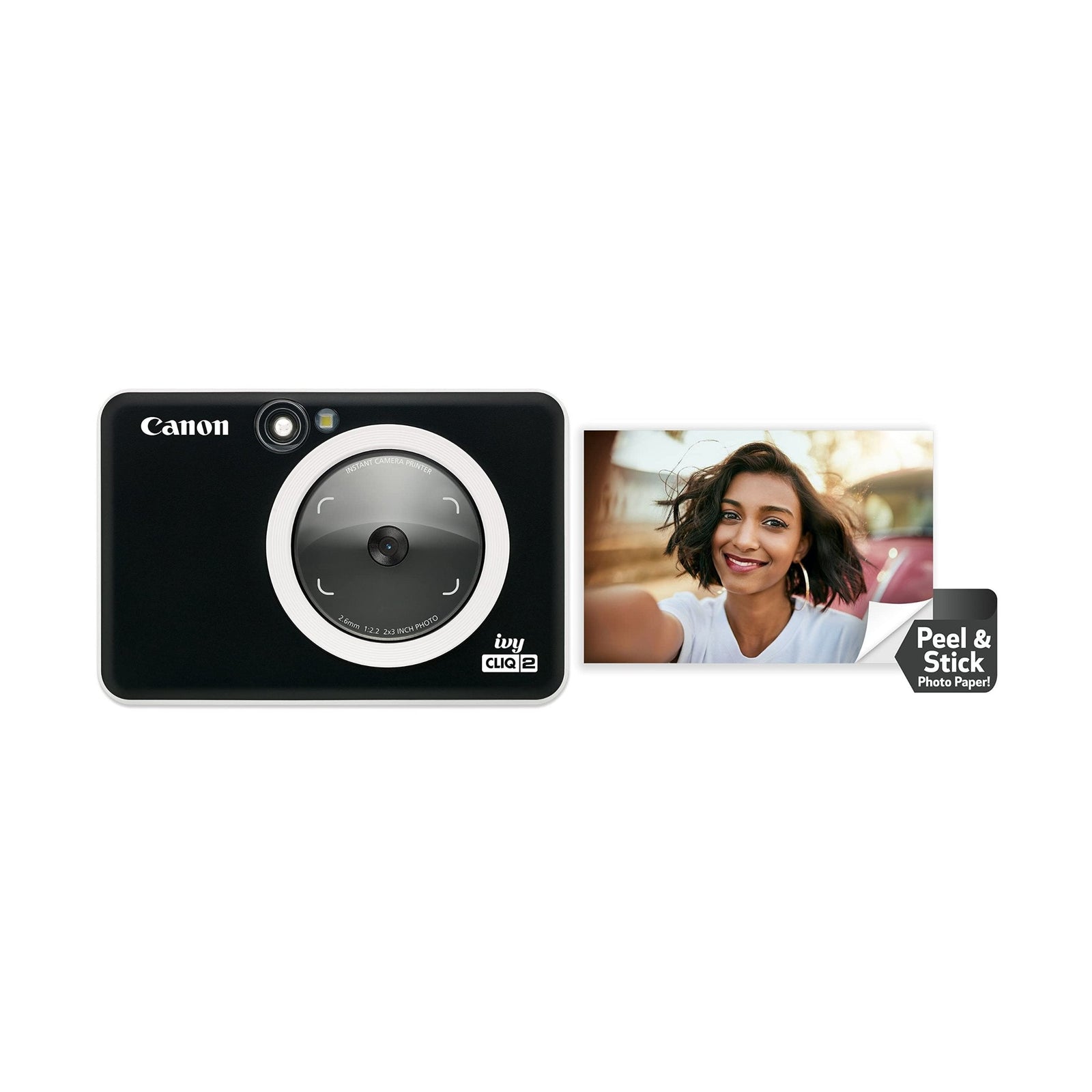 Canon Ivy Cliq2 Black Matte instant camera with textured finish and ring light next to red car peel-and-stick photo at ClubCamera.com