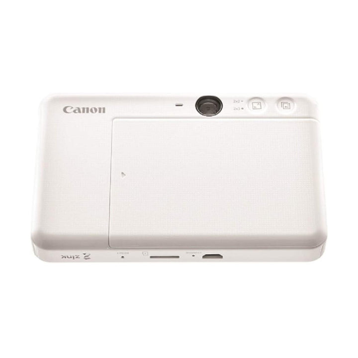 Rear view of Canon Ivy Cliq Plus white ZINK photo printer showing microSD slot, charging port, and 2x3 print buttons at ClubCamera.com