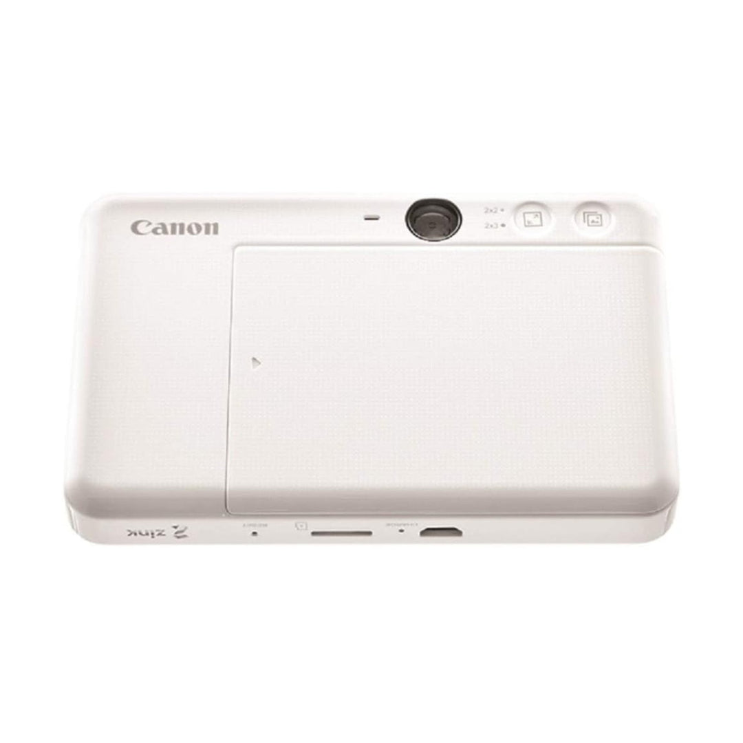 Rear view of Canon Ivy Cliq Plus white ZINK printer showing microSD slot and size buttons at ClubCamera.com
