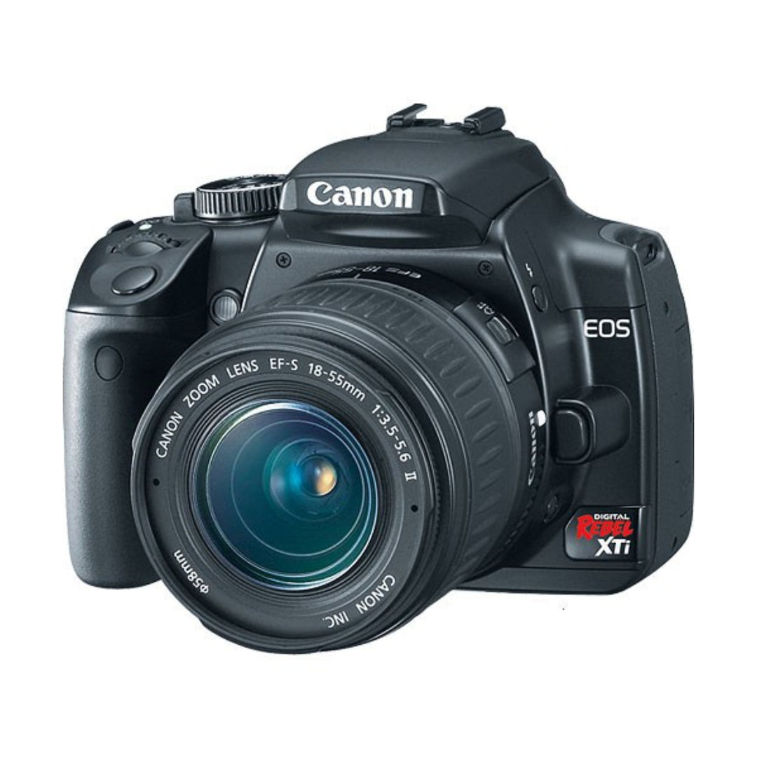 Black Canon Rebel XTi three-quarter angle showing textured grip and EF-S 18-55mm lens at ClubCamera.com