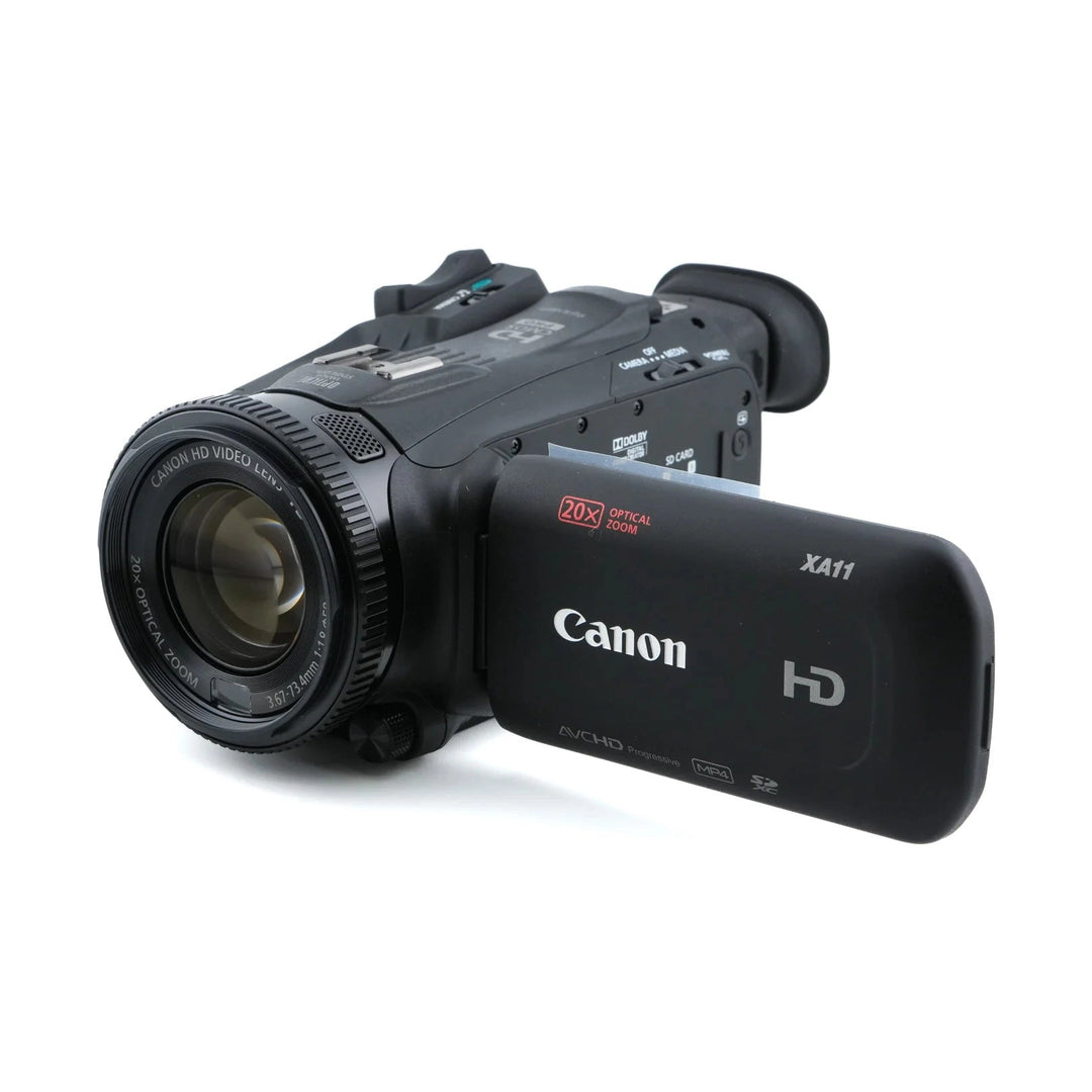 Black Canon XA11 HD camcorder side profile highlighting ribbed focus ring and AVCHD screen icons at ClubCamera.com