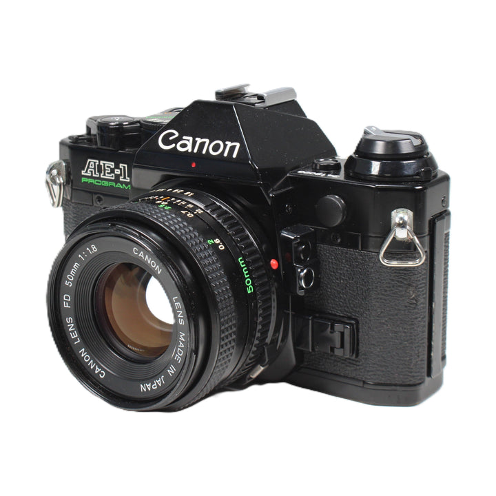 Black Canon AE-1 Program SLR right controls and green aperture dial at ClubCamera.com