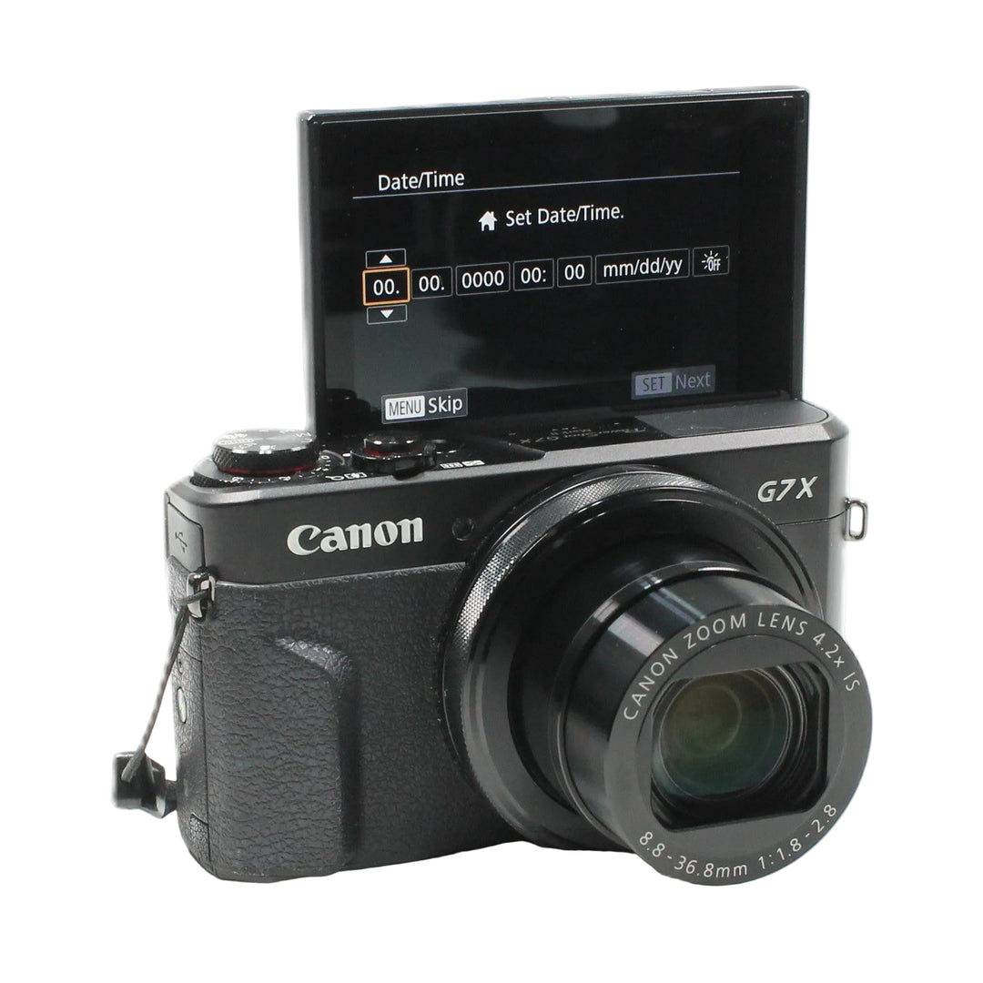 Black Canon G7X Mark II with flip-out screen for vlogging displayed at ClubCamera.com