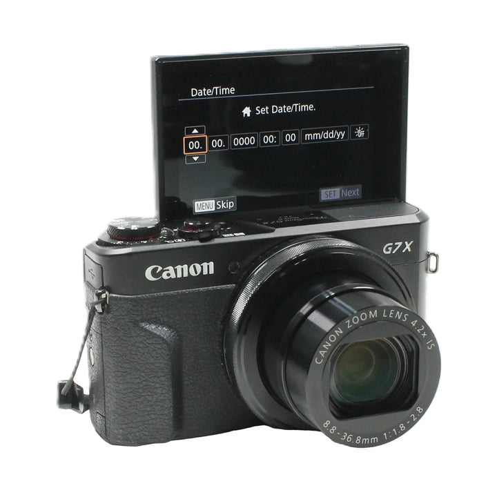 Black Canon G7X Mark II with flip-out screen for vlogging displayed at ClubCamera.com
