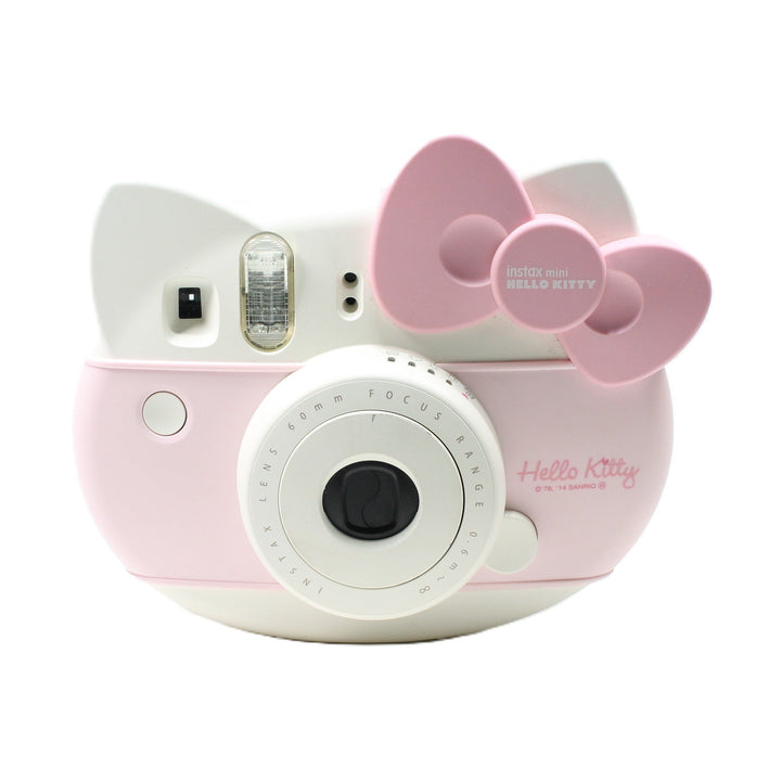 Front of Fujifilm Instax mini HELLO KITTY instant camera with pastel pink bow and Hello Kitty logo at ClubCamera.com