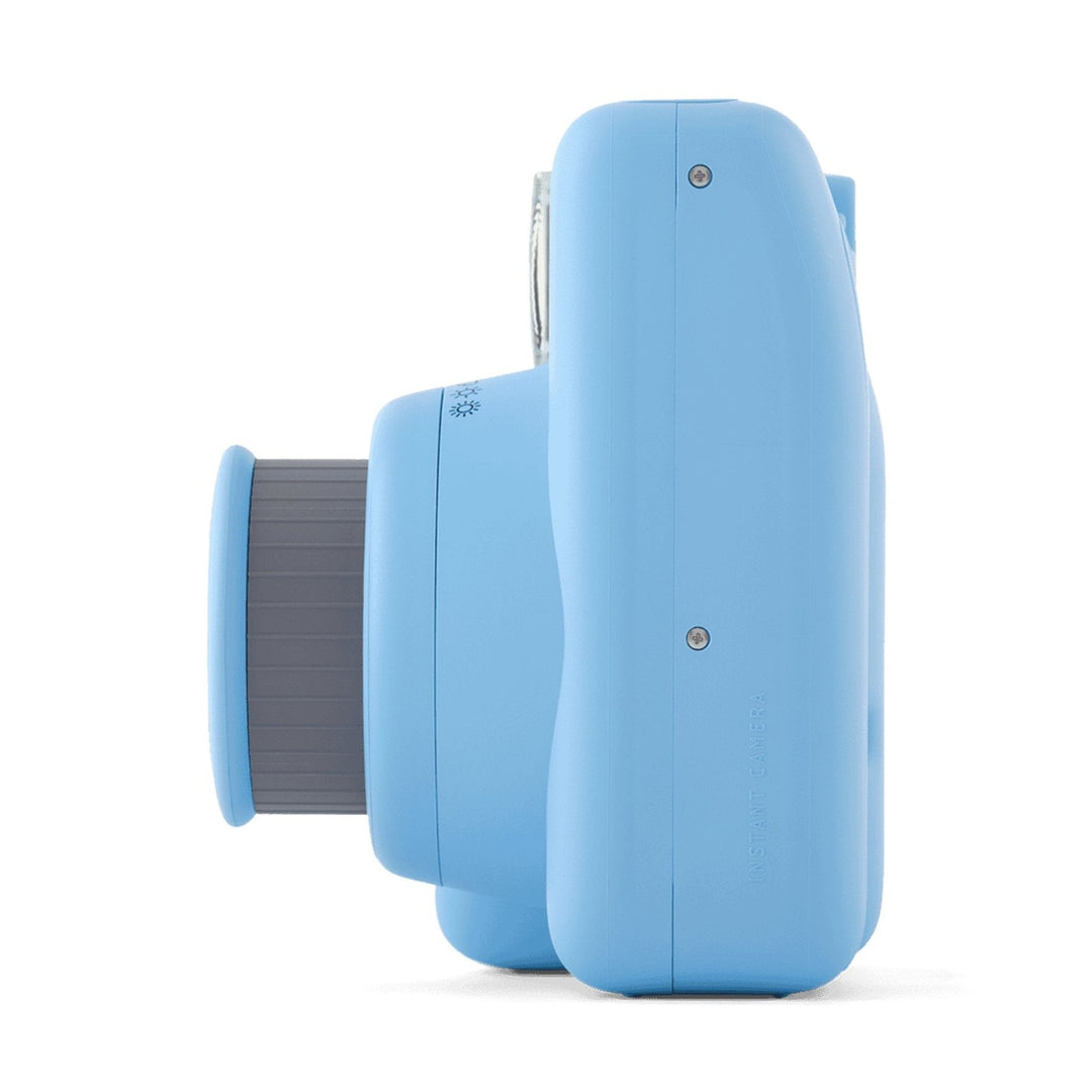 Side profile of light blue INSTAX Mini SE instant camera with grip ring at ClubCamera.com