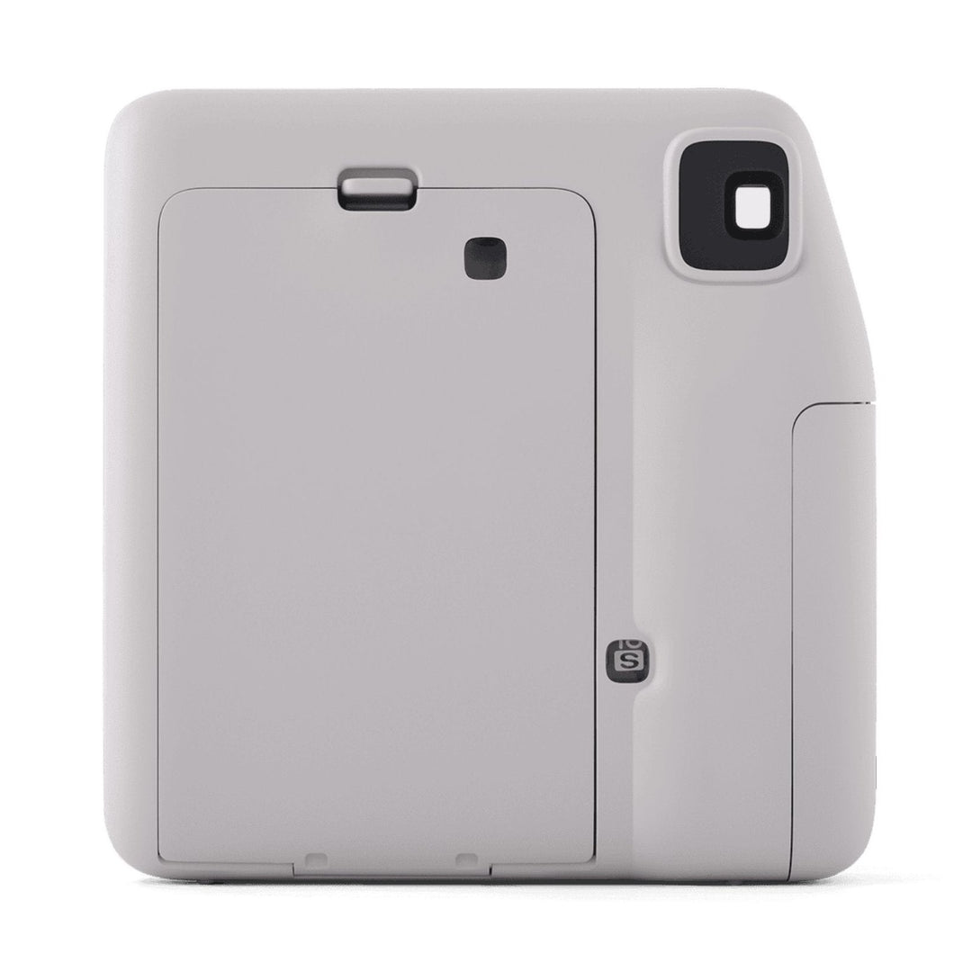 Rear view of gray Fujifilm INSTAX Mini SE showing film door latch and selfie mode indicator at ClubCamera.com