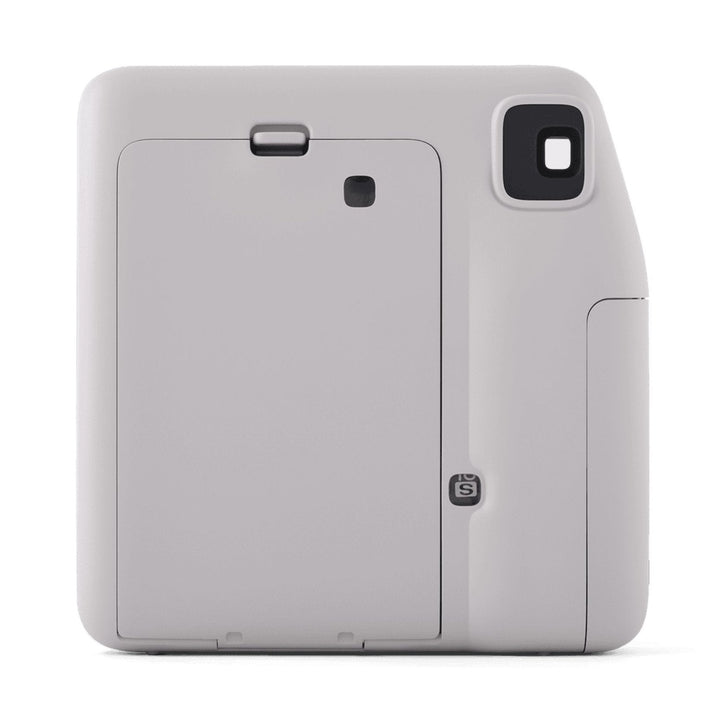 Rear view of gray Fujifilm INSTAX Mini SE showing film door latch and selfie mode indicator at ClubCamera.com
