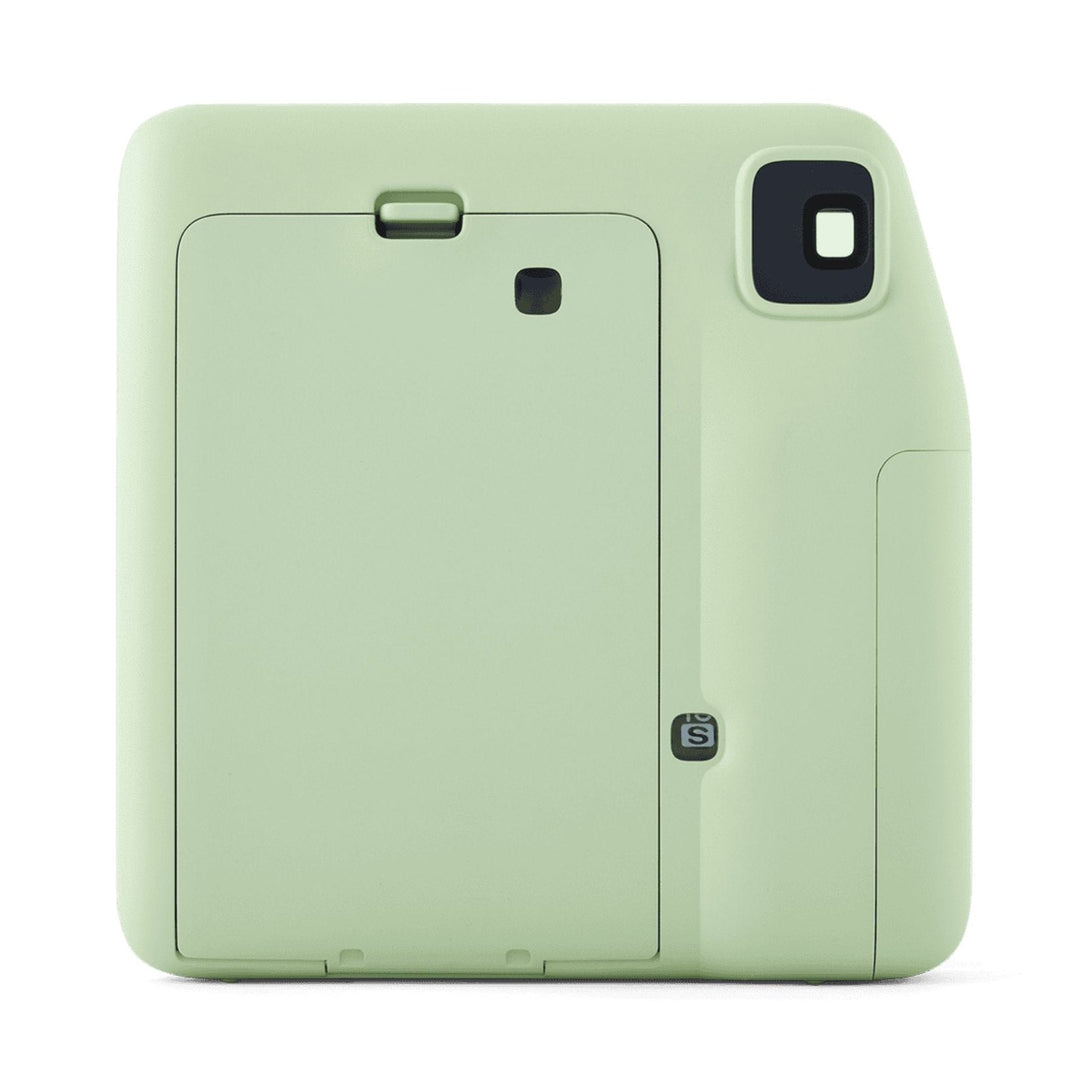 Rear view of light green Fujifilm INSTAX Mini SE showing battery compartment and flash sensor at ClubCamera.com