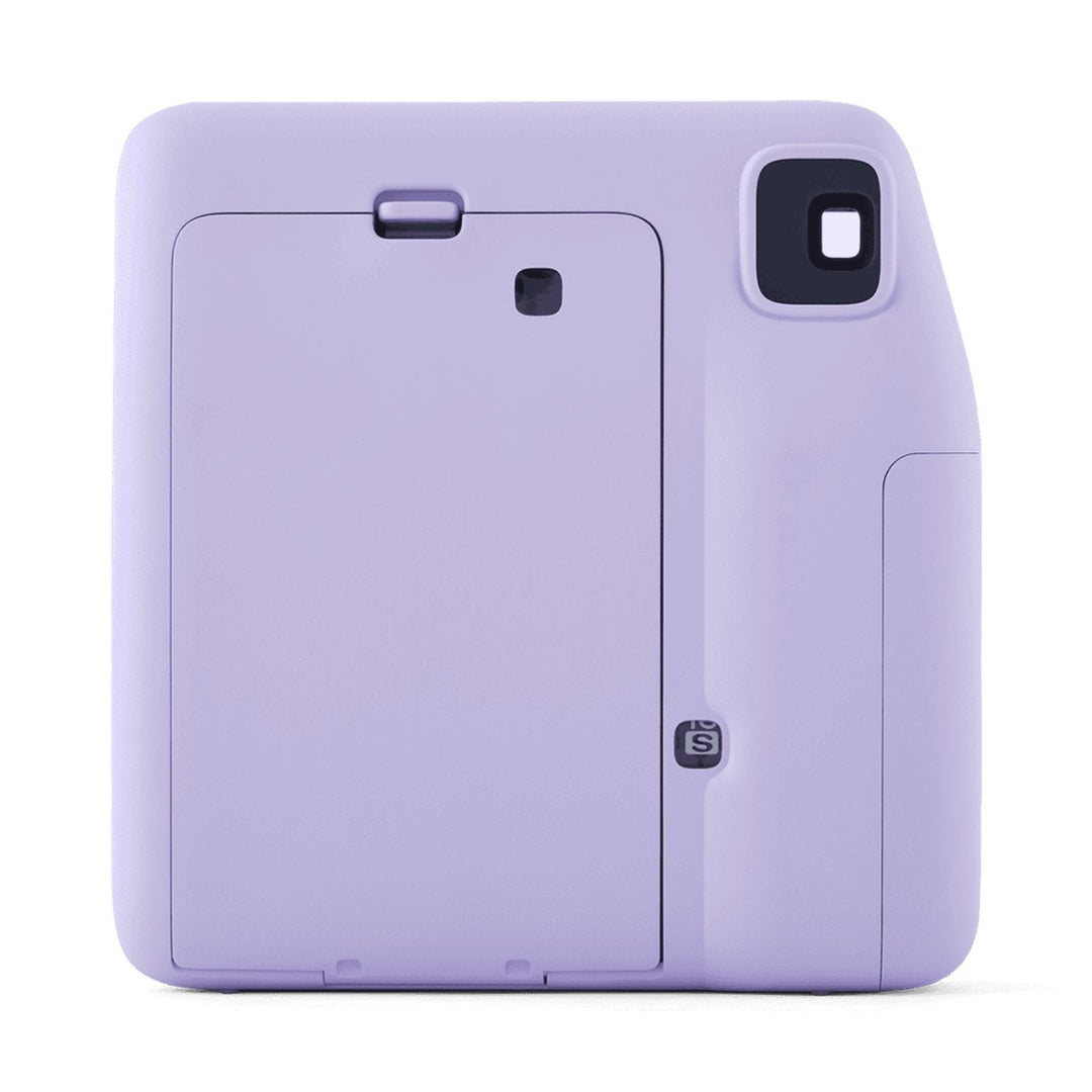 Back view of Fujifilm INSTAX Mini SE instant camera showing film compartment door and S mode button in lavender purple by ClubCamera.com