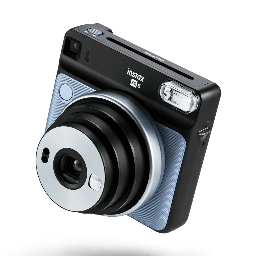 Side profile of Fujifilm INSTAX Square SQ6 Aqua Blue showing slim ergonomic design, USB-C port, and mode dial at ClubCamera.com