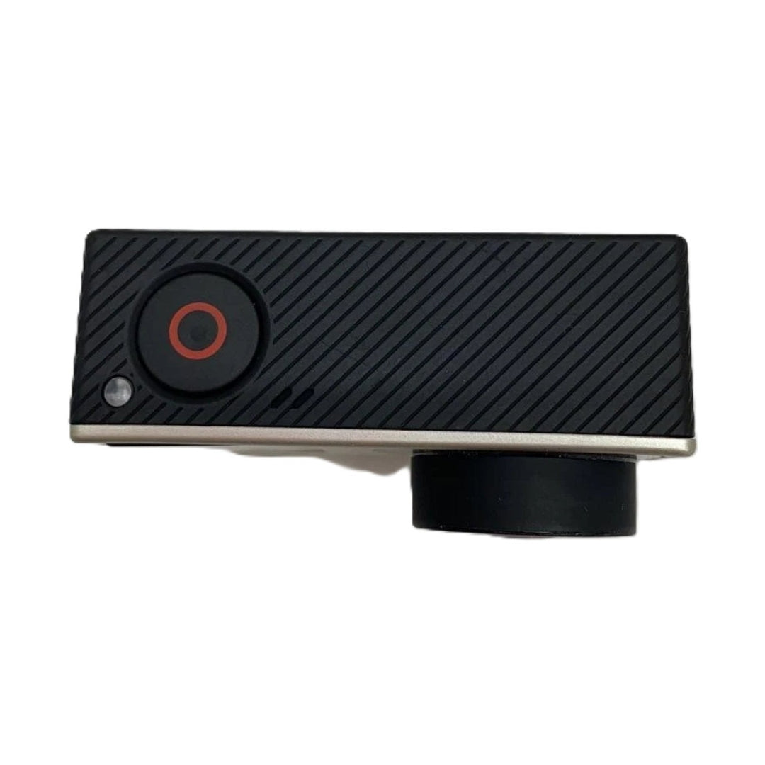 Side close-up of GoPro HERO4 Black Edition action camera highlighting orange-ringed record button and ribbed grip at ClubCamera.com