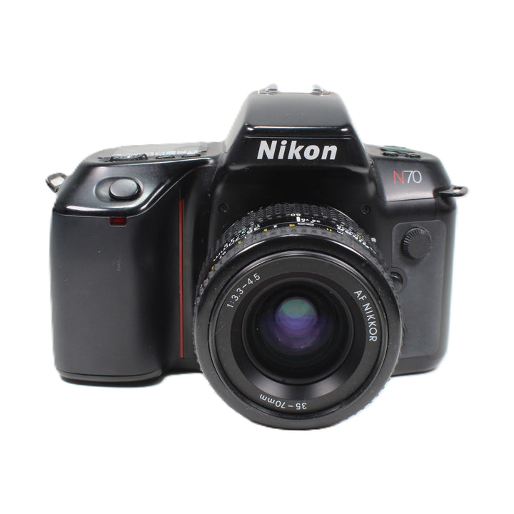 Front view of black Nikon N70 35mm film camera with purple coated AF Nikkor lens and red body stripe at ClubCamera.com