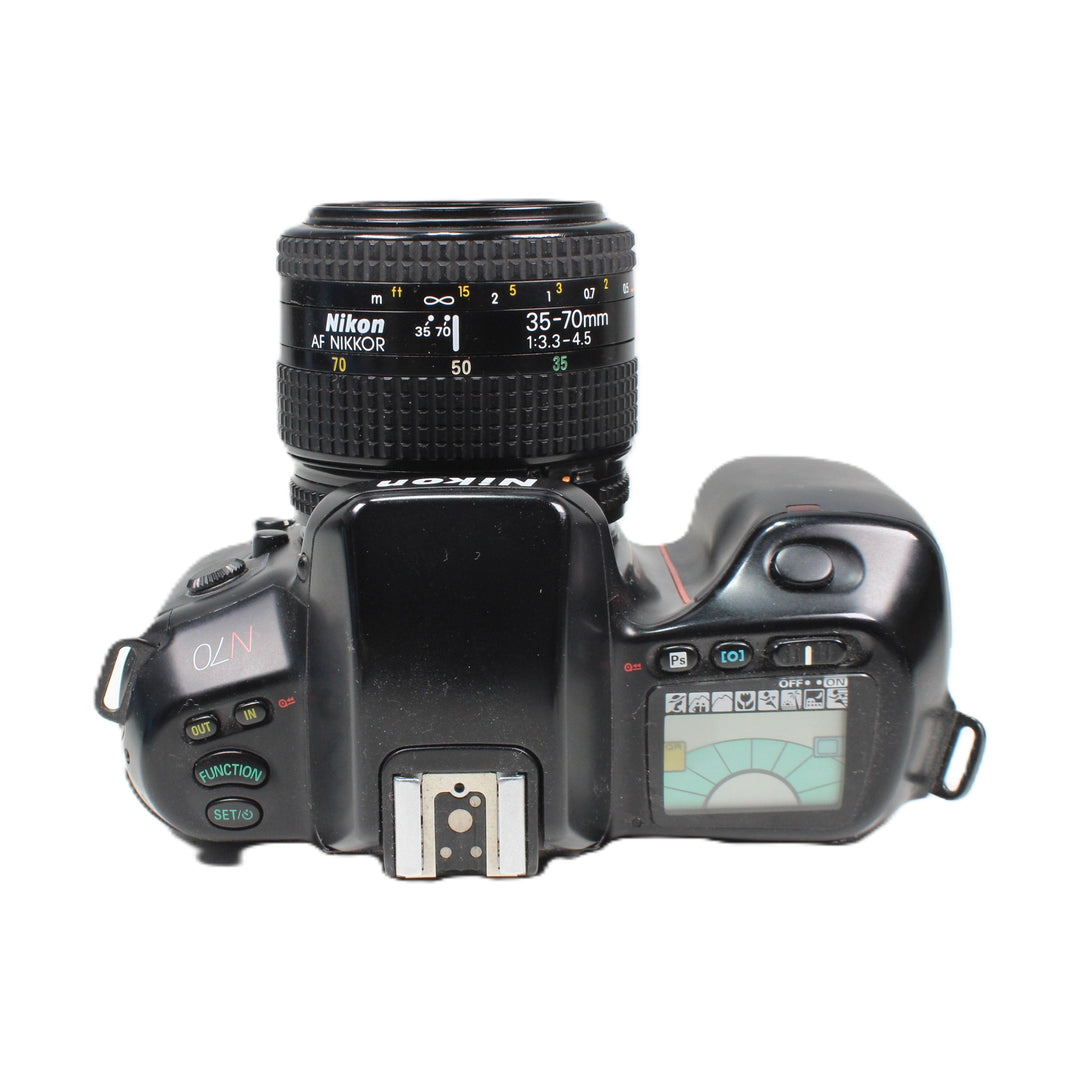 Nikon N70 35mm SLR film camera kit with AF Nikkor lens at ClubCamera.com showing teal LCD exposure meter and textured focus ring
