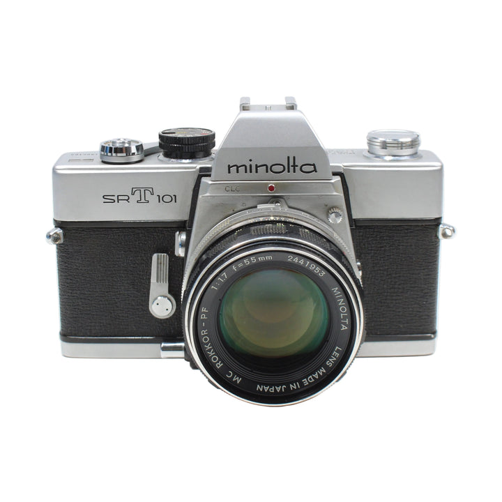 ClubCamera centered Minolta SRT-101 35mm SLR with chrome trim and MC Minolta lens details