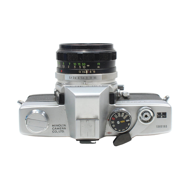 ClubCamera silver Minolta SRT-101 SLR camera top view with black grip and Rokkor lens