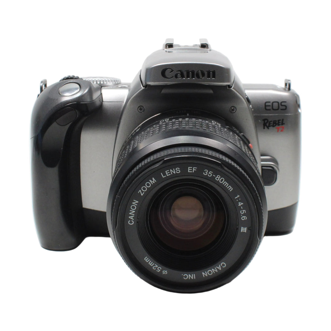 Front view of silver Canon Rebel T2 SLR with black EF 35-80mm zoom lens at ClubCamera.com