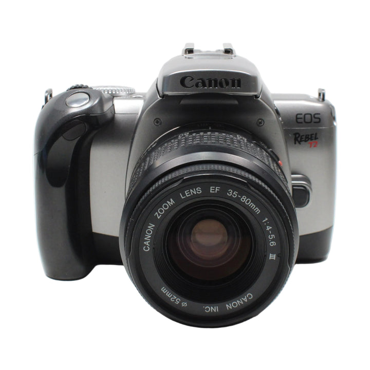 Front view of silver Canon Rebel T2 SLR with black EF 35-80mm zoom lens at ClubCamera.com