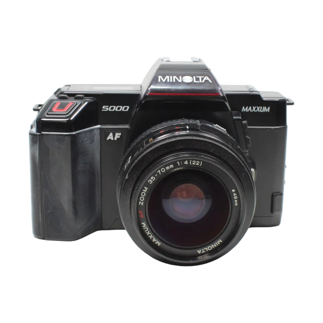 Front shot of classic black Minolta Maxxum 5000 35mm SLR film camera kit with AF zoom lens by ClubCamera.com