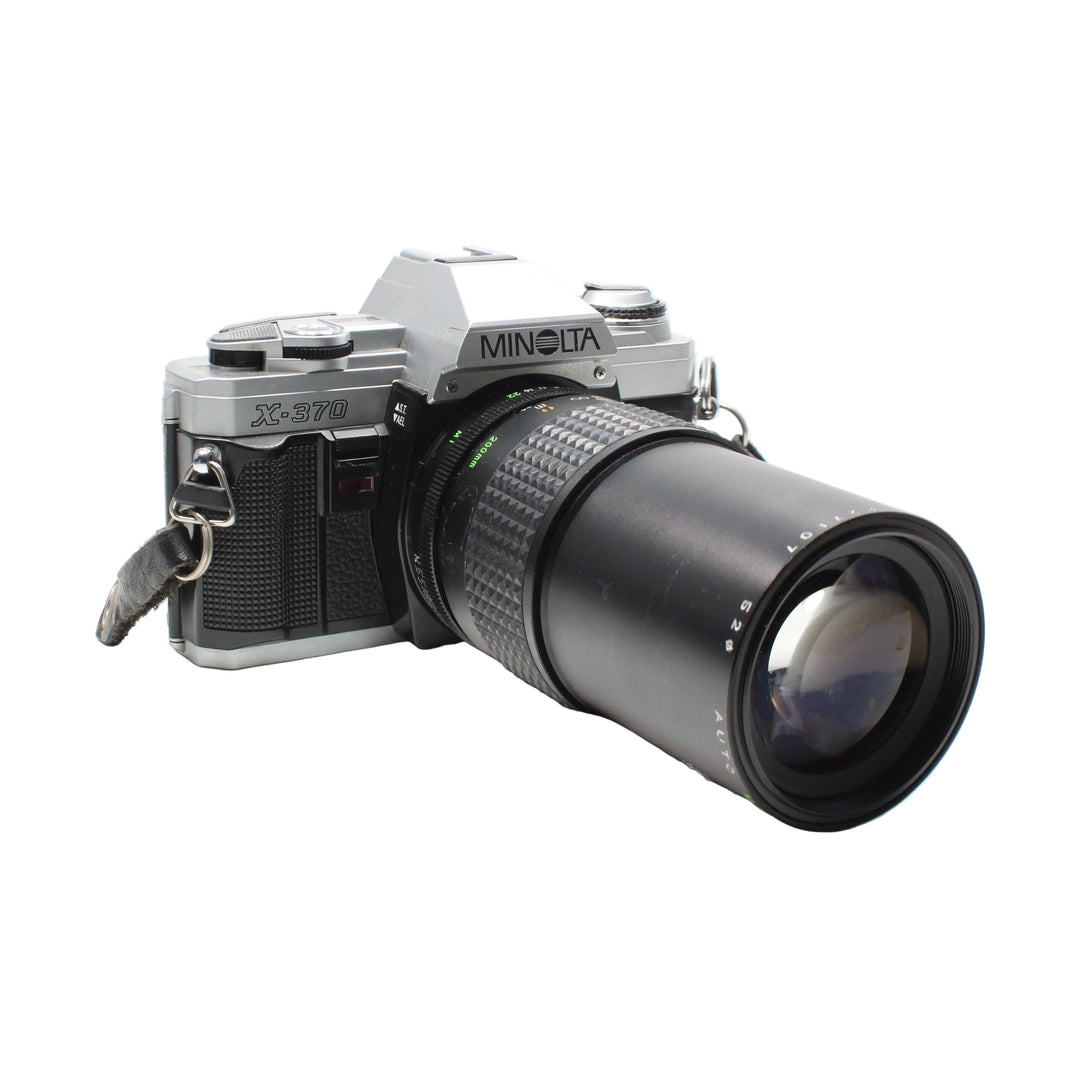 Minolta X-370 200mm f/2.8 zoom lens side view with A/F switch at ClubCamera.com