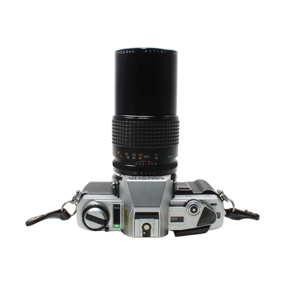 Top-down Minolta X-370 shutter speed dial and hot shoe with 200mm lens at ClubCamera.com