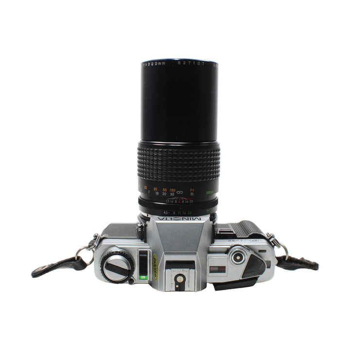 Top-down Minolta X-370 shutter speed dial and hot shoe with 200mm lens at ClubCamera.com