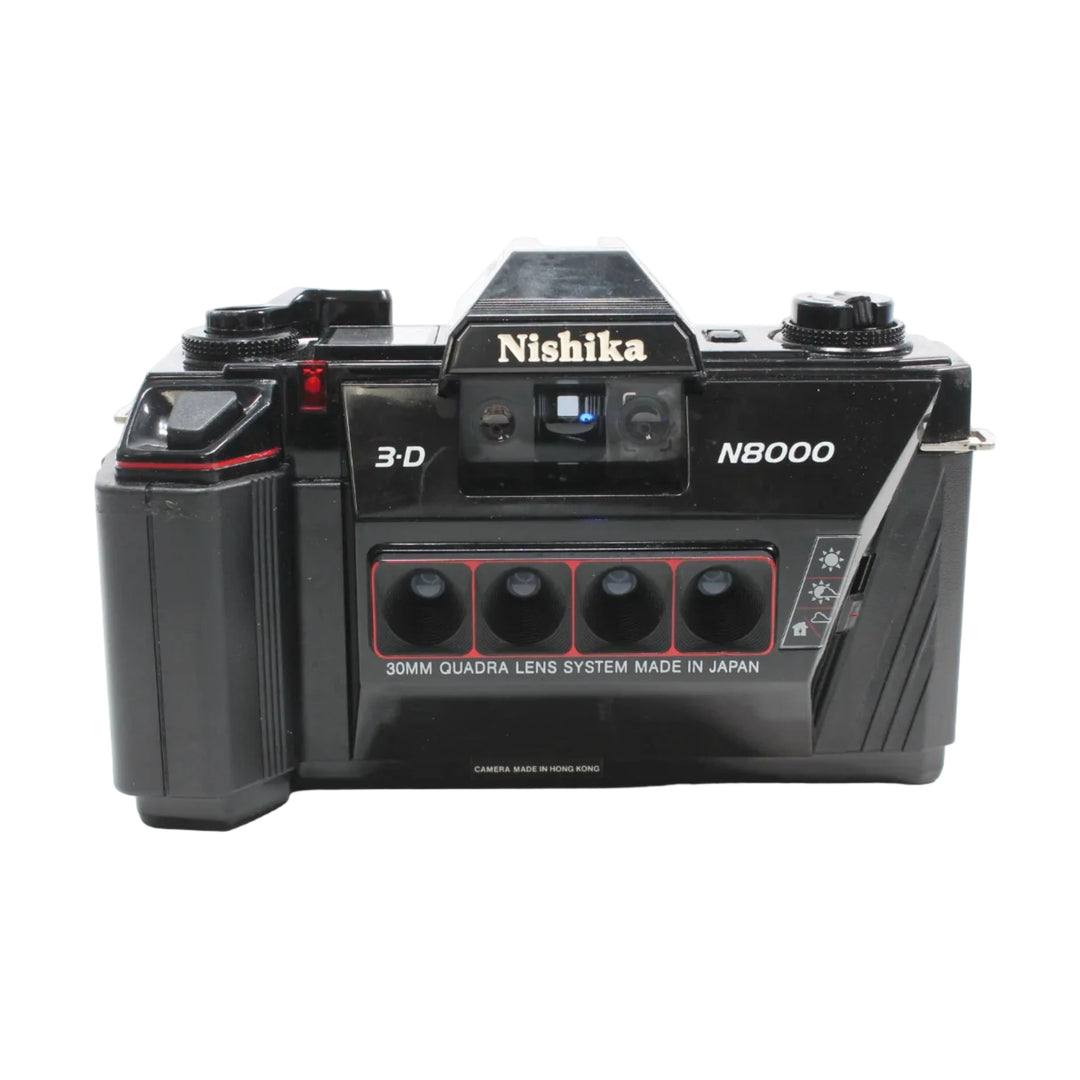 Front of black Nishika N8000 quad-lens 3D film camera with gold logo and red lens frame at ClubCamera.com