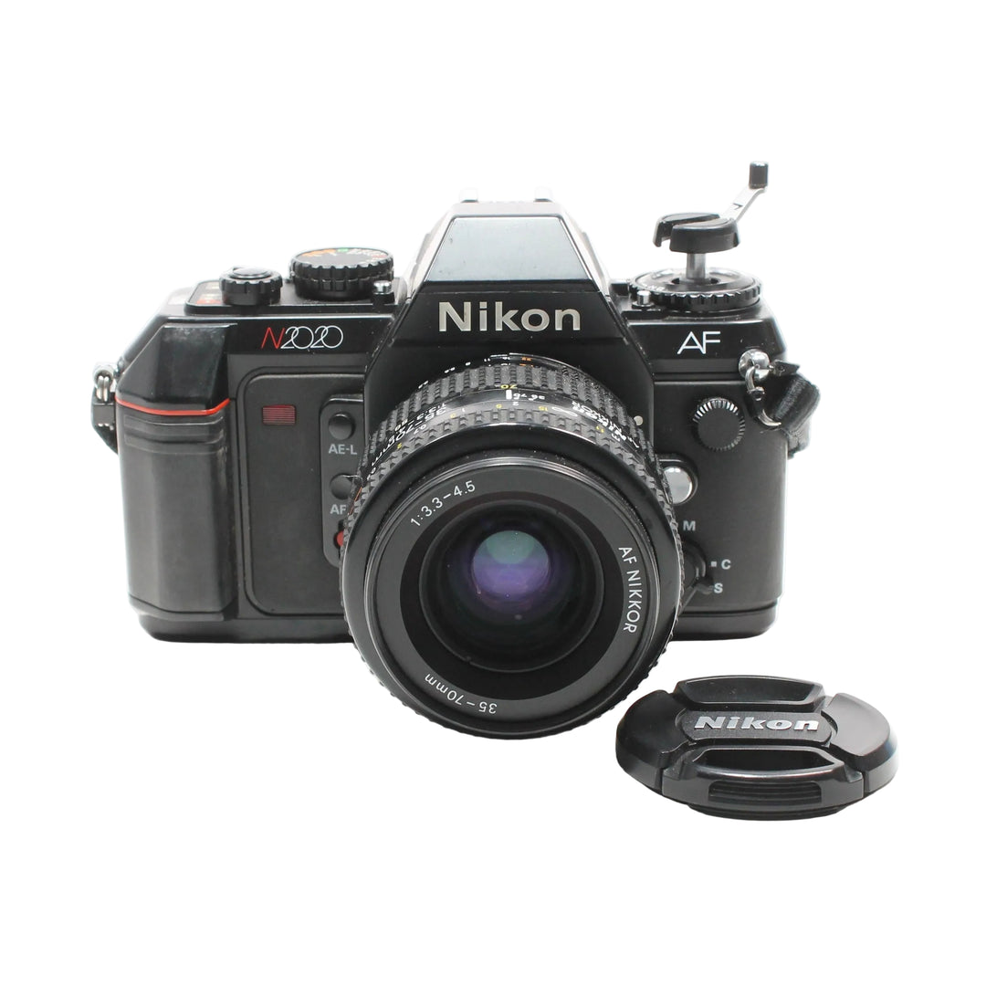 Front profile of Nikon N2020 35mm film camera with purple coated lens glass available at ClubCamera.com