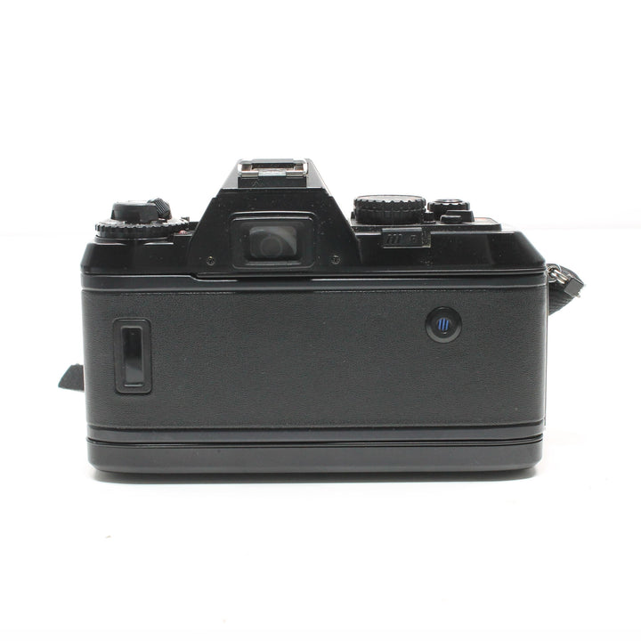 Rear view of vintage Nikon N2020 35mm SLR film camera with blue eyepiece sold by ClubCamera.com