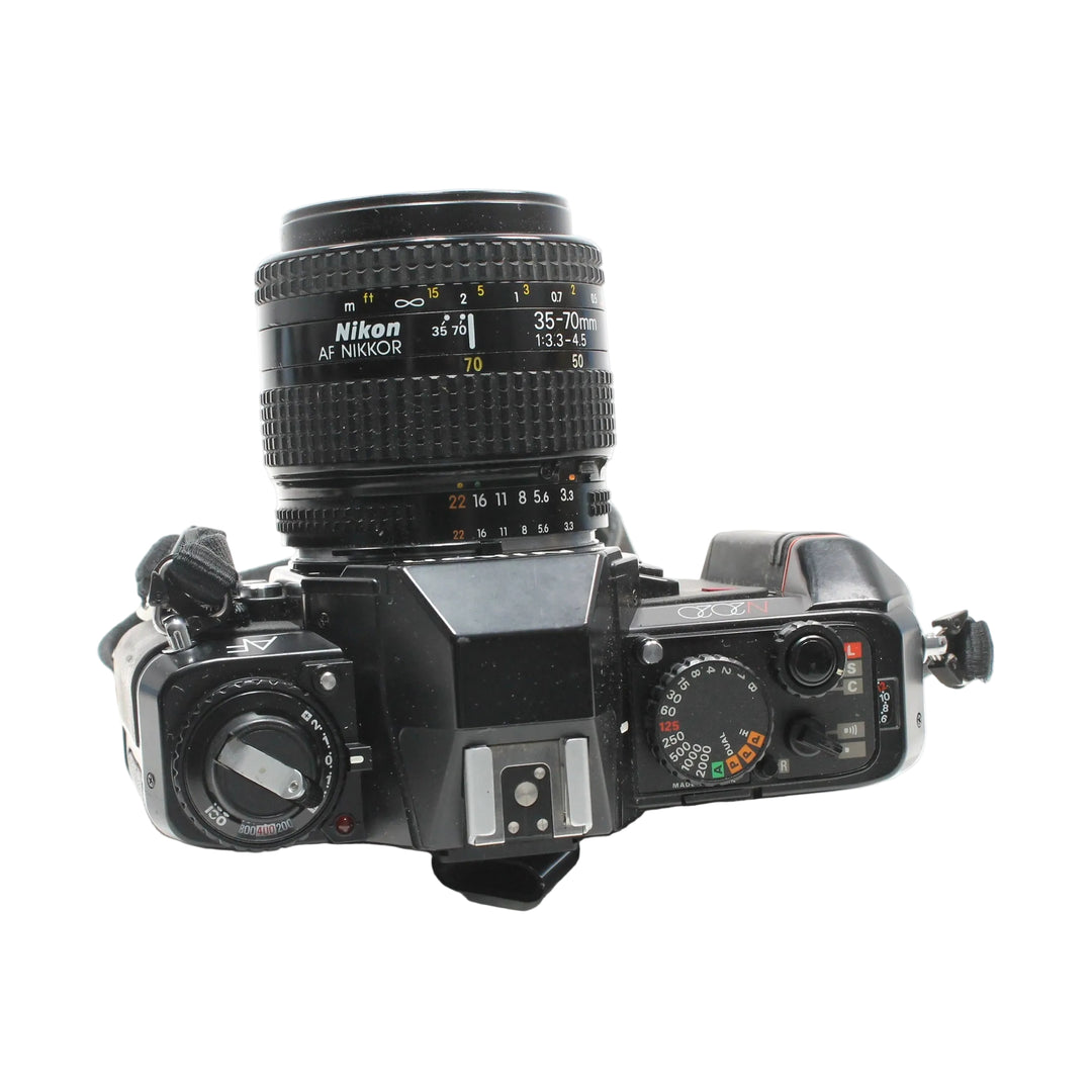 Top view of black Nikon N2020 SLR with ISO dial and shutter speed settings from ClubCamera.com