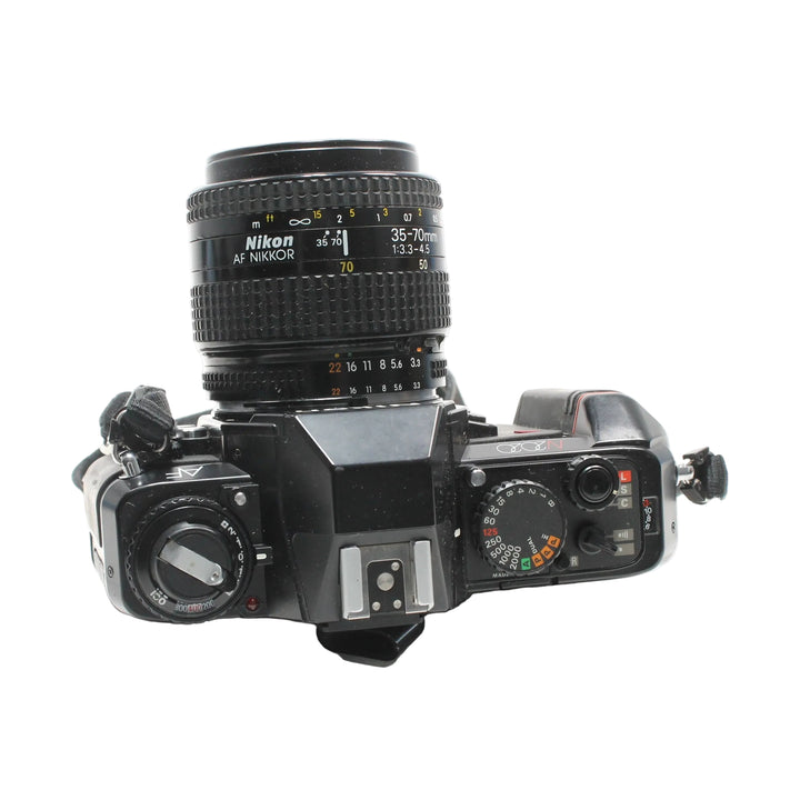Top view of black Nikon N2020 SLR with ISO dial and shutter speed settings from ClubCamera.com
