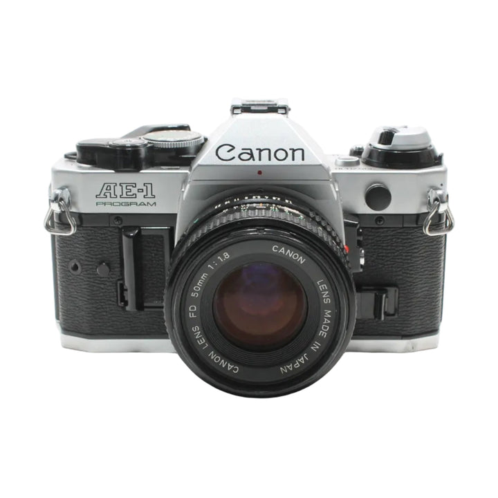 Canon AE-1 Program 35mm SLR film camera with FD 50mm lens by ClubCamera.com