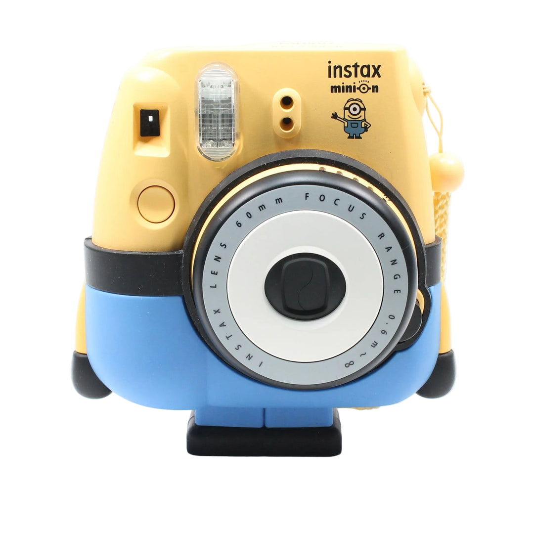 Fujifilm Instax Mini 8 Minion Edition yellow instant camera with blue overalls design and stand by ClubCamera.com