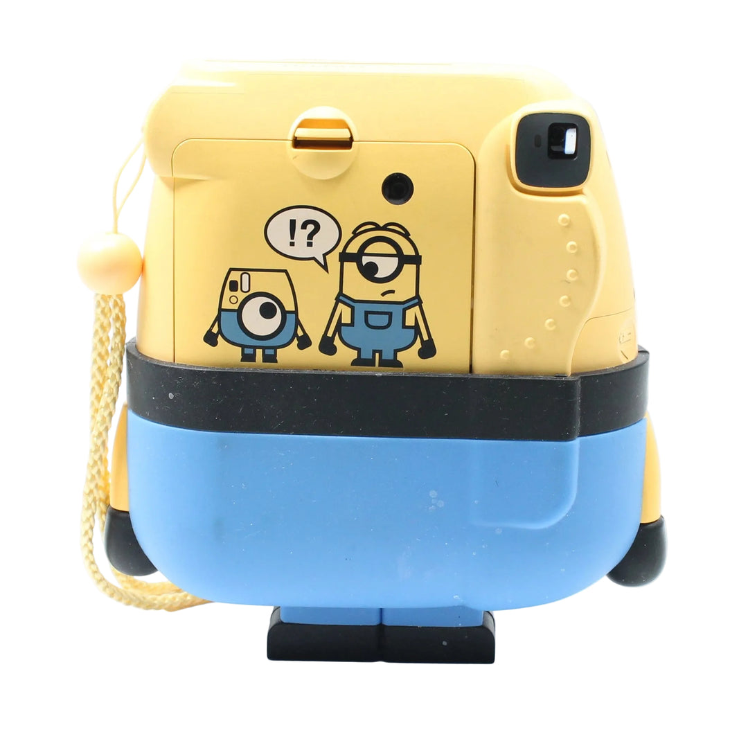 Back panel of yellow Minion Instax Mini 8 camera displaying dual character sticker and matte plastic texture at ClubCamera.com