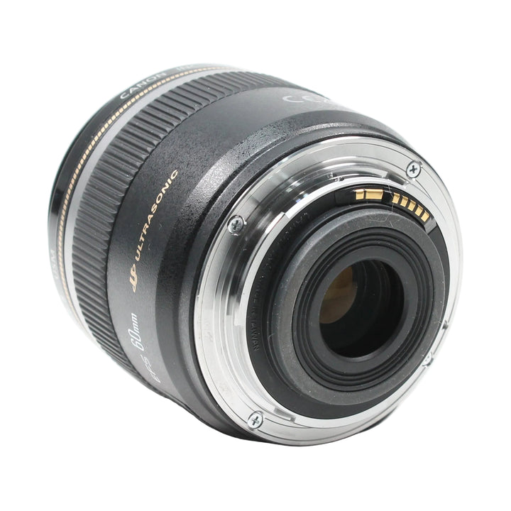 Rear view of Canon EF-S 60mm f/2.8 Macro USM lens highlighting silver mount ring and gold electrical contacts