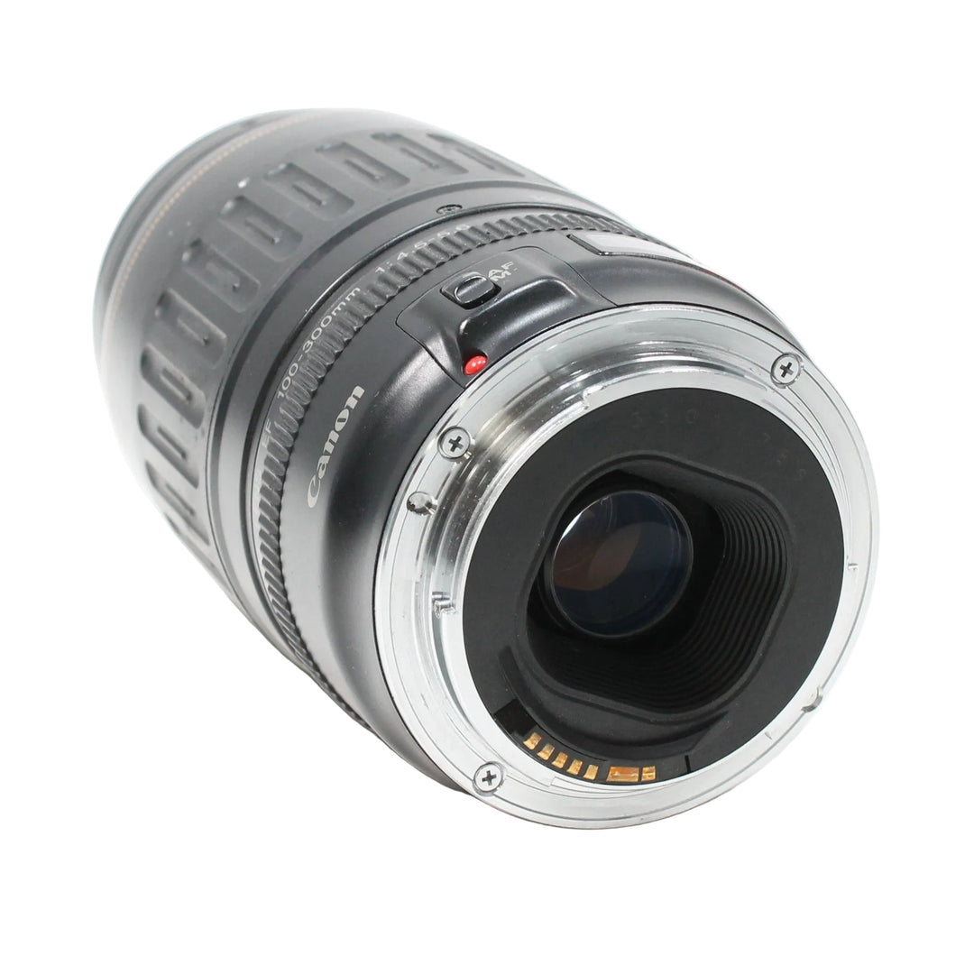Canon EF mount rear interface of ClubCamera.com 100-300mm lens showing gold contacts and red AF/MF switch indicator
